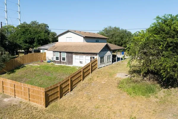 a aerial view of a house with a yard