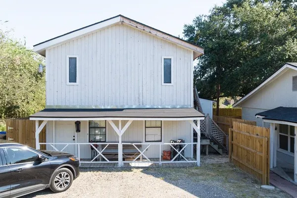 a view of a car park in front of house
