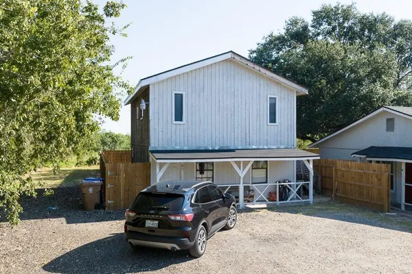 a car parked in front of a house
