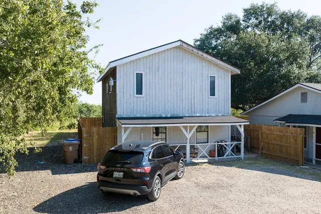 a car parked in front of a house