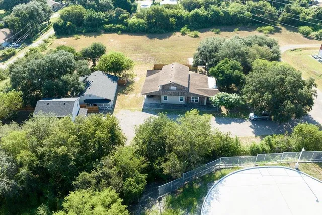 an aerial view of a house with lake view