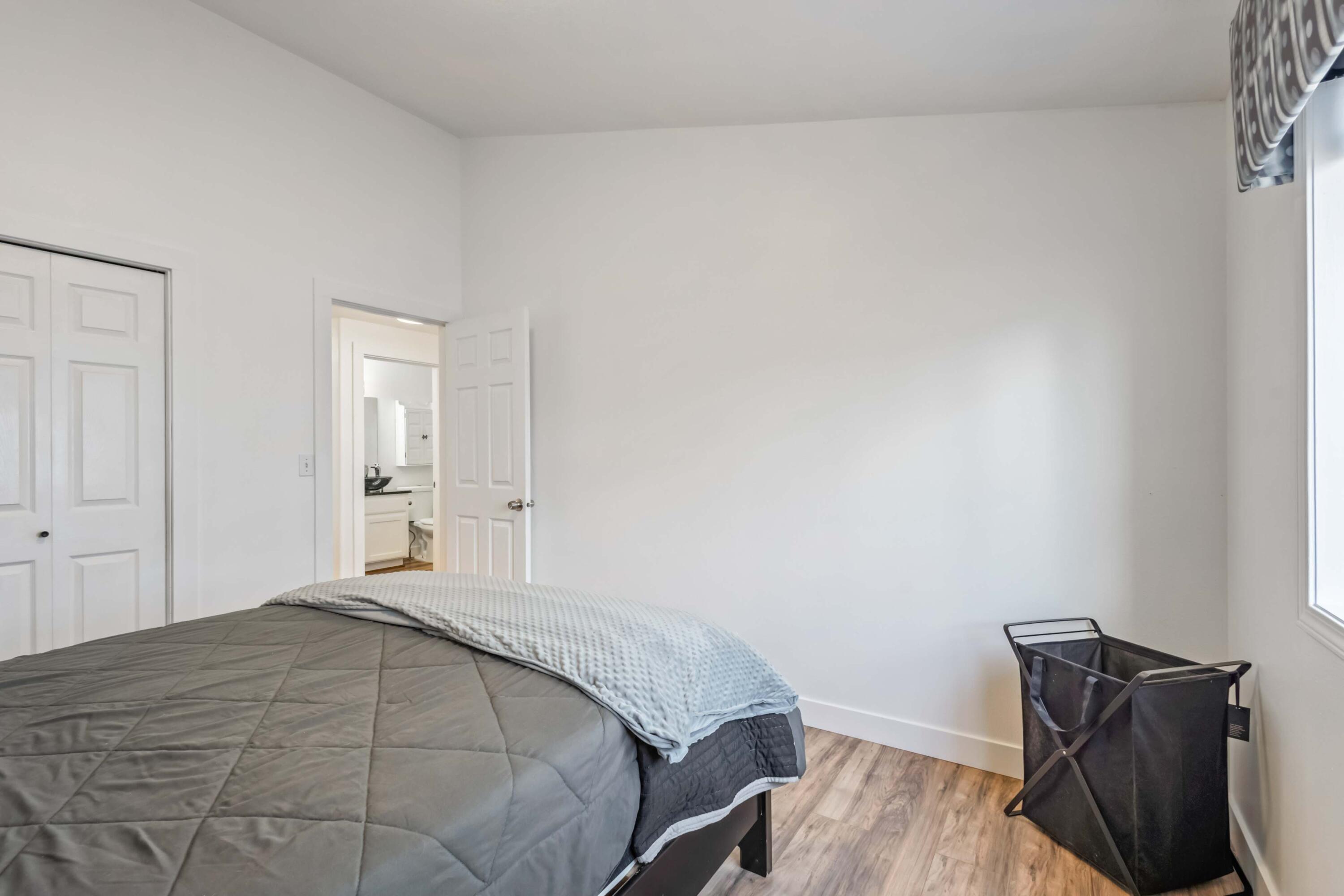 405 East D Street Culver, OR 97734 - Photo 19 of 49 a bedroom with a bed and wooden floor