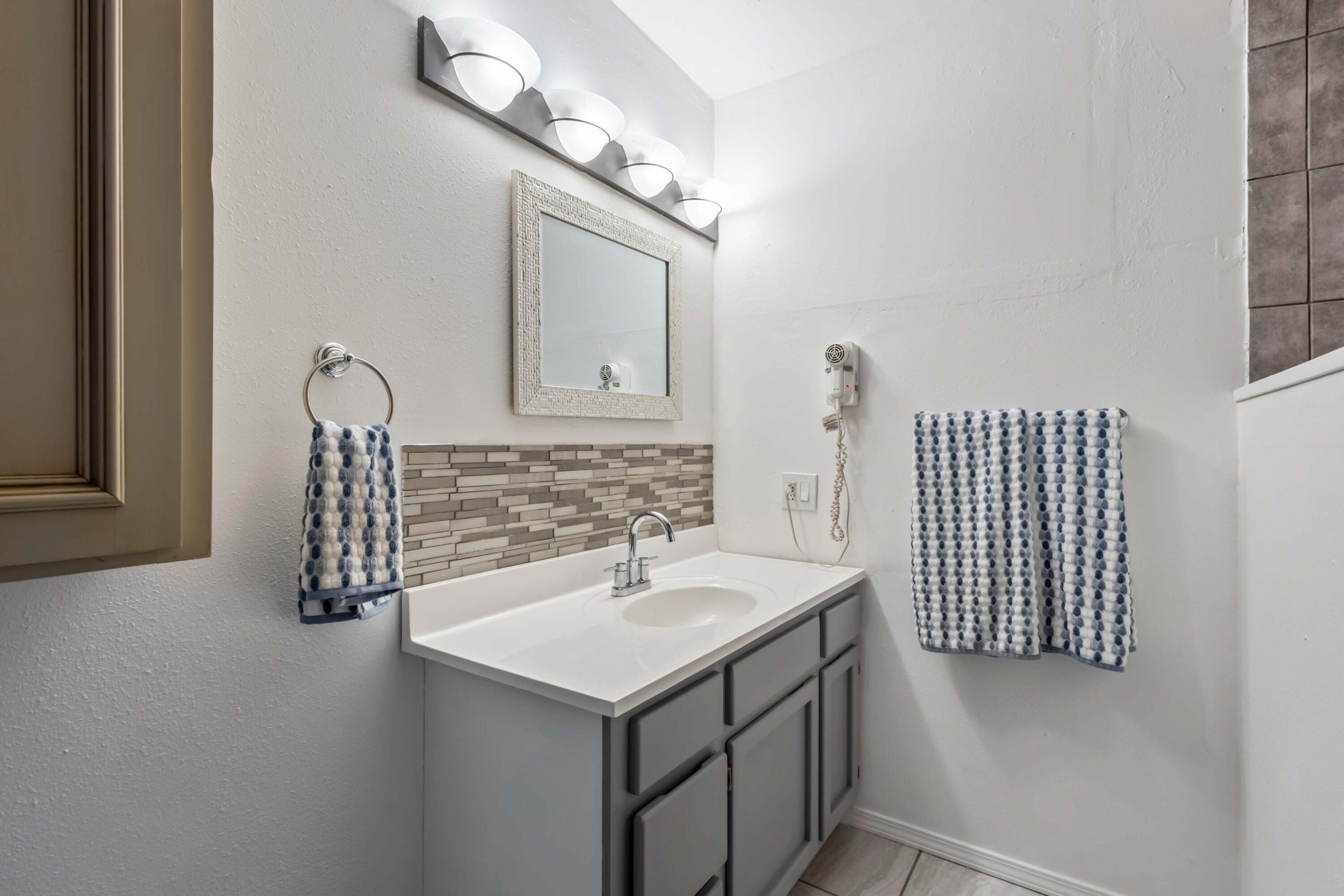 405 East D Street Culver, OR 97734 - Photo 28 of 49 a bathroom with a sink and a mirror