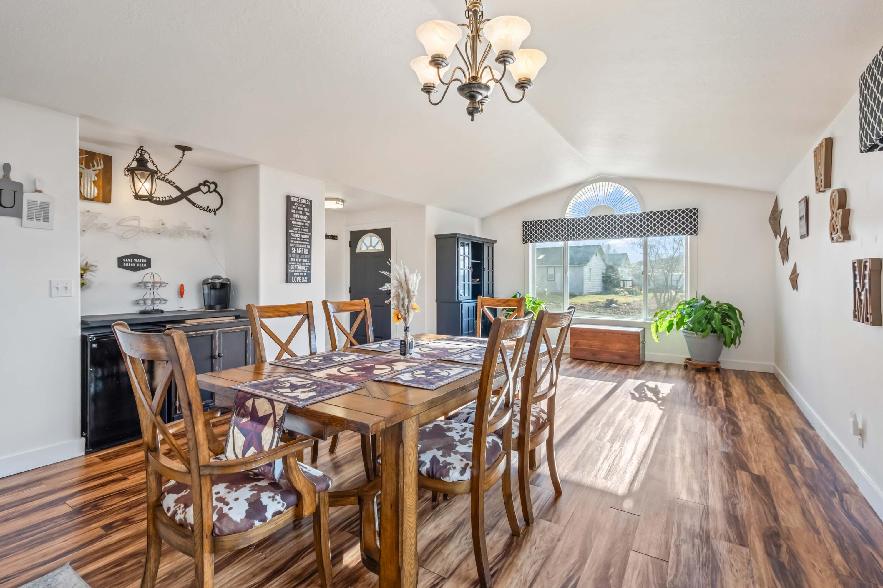 405 East D Street Culver, OR 97734 - Photo 7 of 49 a view of a dining room with furniture a chandelier and wooden floor