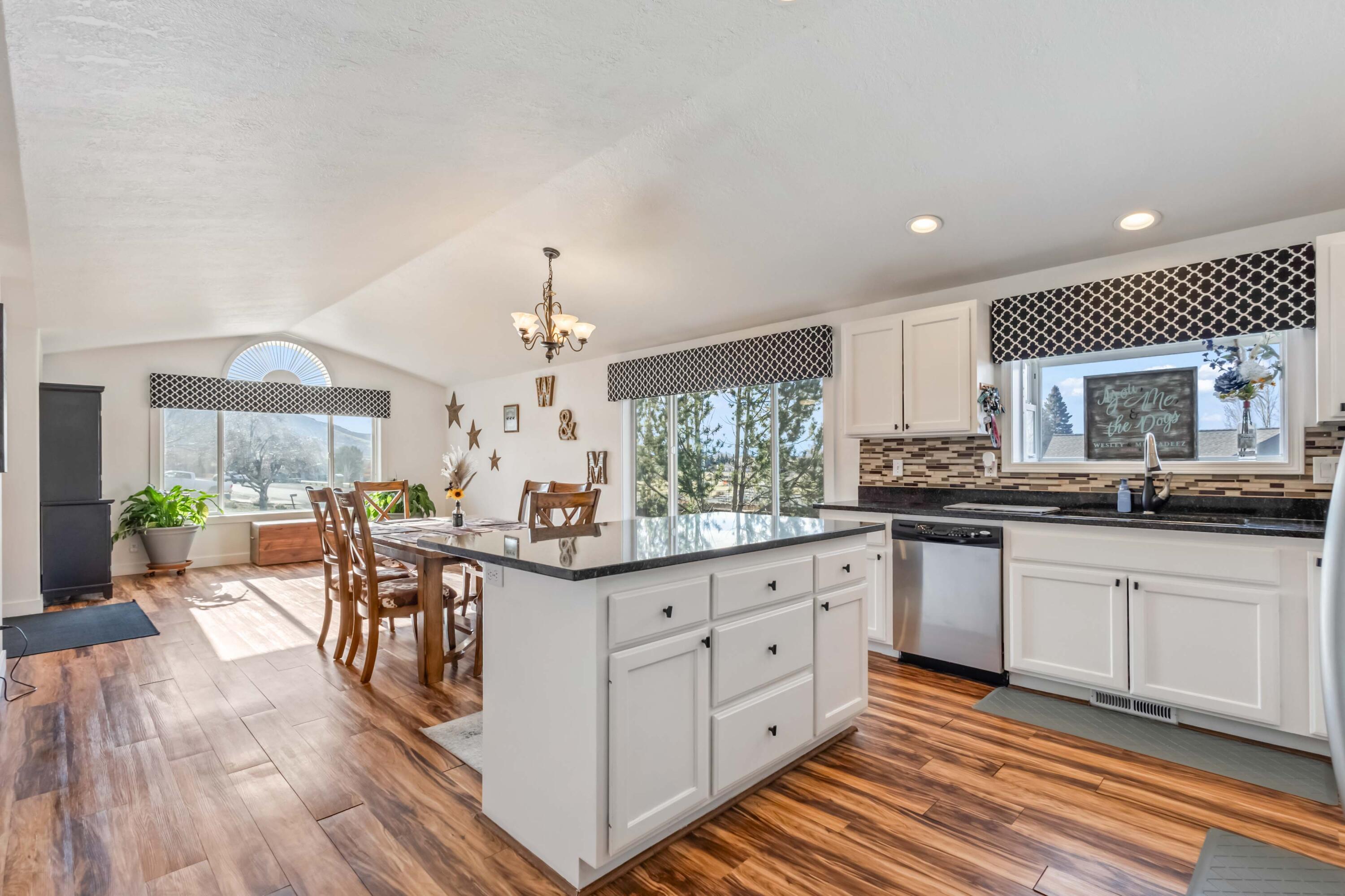 405 East D Street Culver, OR 97734 - Photo 9 of 49 a kitchen with granite countertop cabinets a sink and appliances