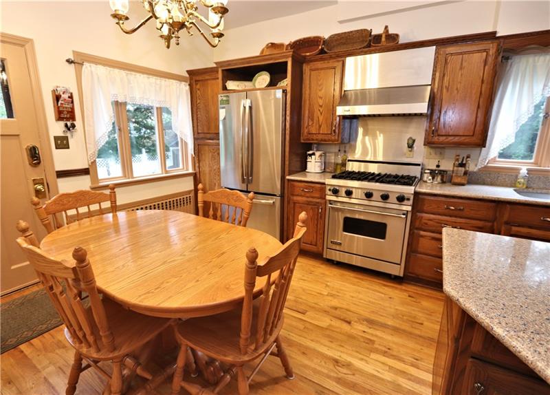 Kitchen 2 - New french door refrigerator and Viking gas stove.  Ample space for informal dining.