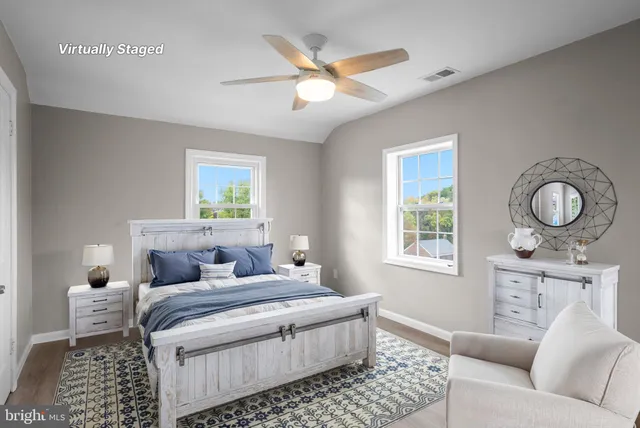 a bedroom with a large bed and a window