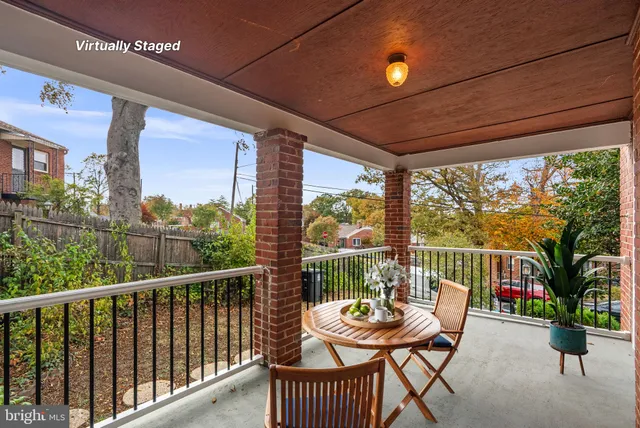 a view of a chairs and table in the balcony