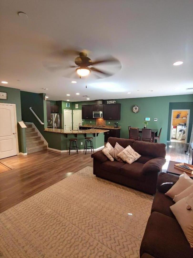 100 Caspian Way Gilroy, CA 95020 - Photo 4 of 7 a living room with furniture and a wooden floor