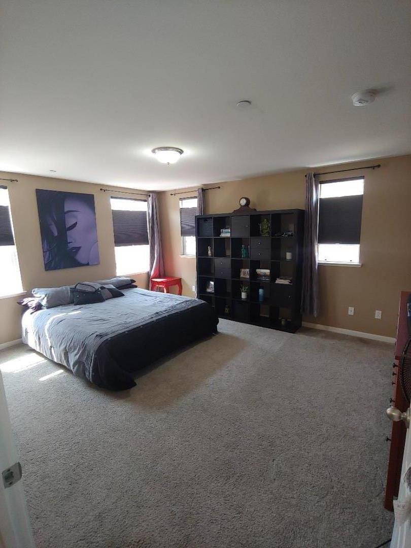 100 Caspian Way Gilroy, CA 95020 - Photo 6 of 7 a bedroom with a large bed and dresser