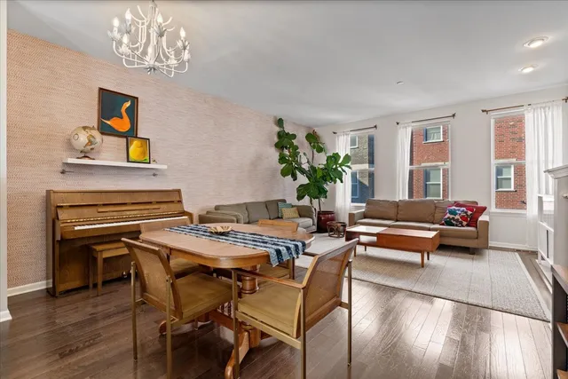 a dining room with furniture a livingroom and chandelier