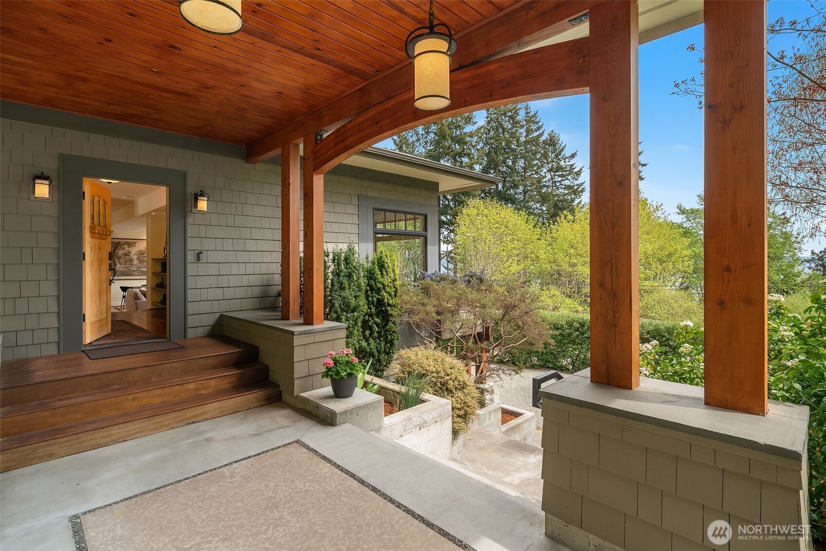 8302 Southwest Dilworth Road Vashon, WA 98070 - Photo 3 of 40 a building outdoor space with patio furniture and potted plants