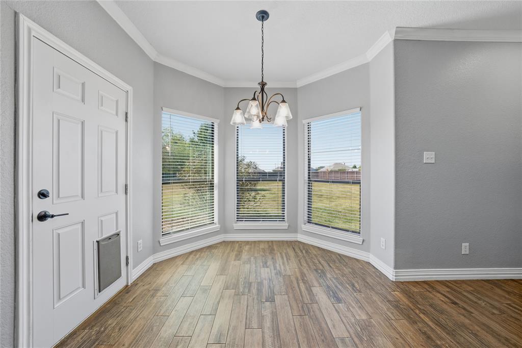 17821 Fm 3080 Mabank, TX 75147 - Photo 7 of 23 a view of a room with wooden floor exposed radiator and windows