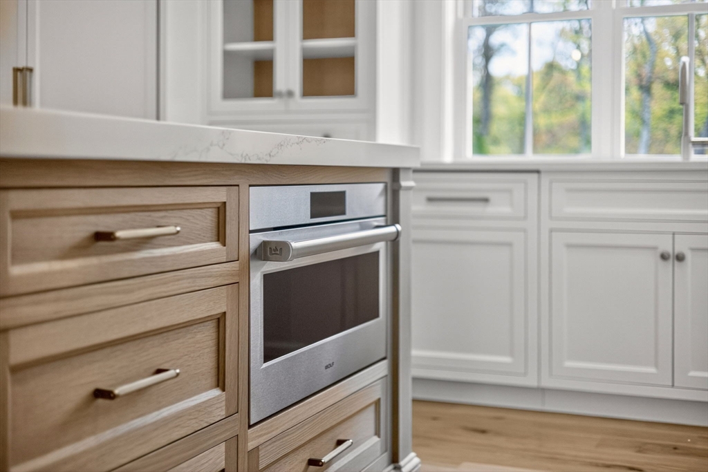 132 Great Western Road Harwich, MA 02645 - Photo 19 of 42 a kitchen with a stove and a cabinet