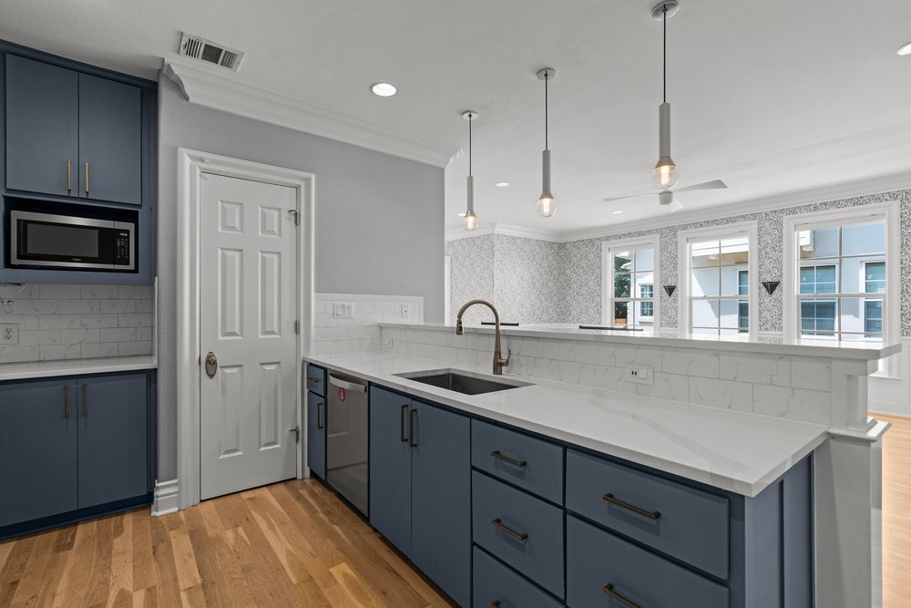 1609 Hartford Road, Unit A Austin, TX 78703 - Photo 24 of 39 Culinary adventures await in this kitchen, boasting pristine countertops, abundant storage, and a seamless flow into living areas.