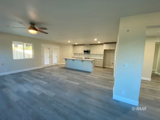 1220 Porter Street Ridgecrest, CA 93555 - Photo 3 of 6 a view of kitchen and hall with wooden floor