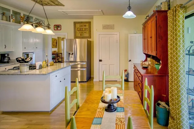 a bedroom with a bed and a flat tv screen