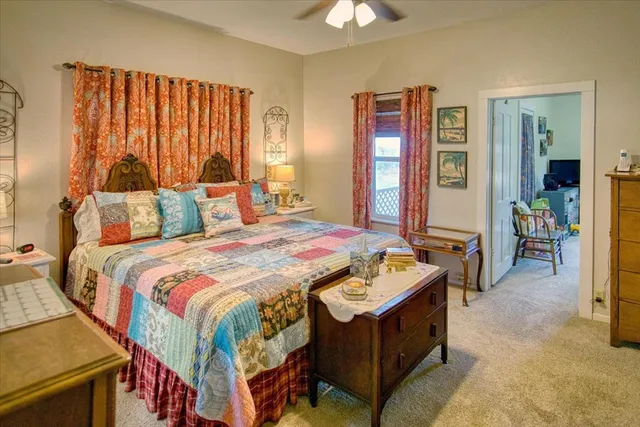 a view of a room with wooden floor and floor to ceiling windows with wooden floor