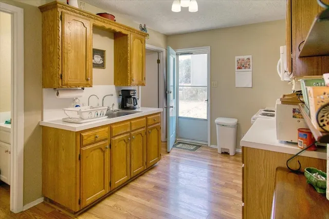 a view of backyard with tub and trees