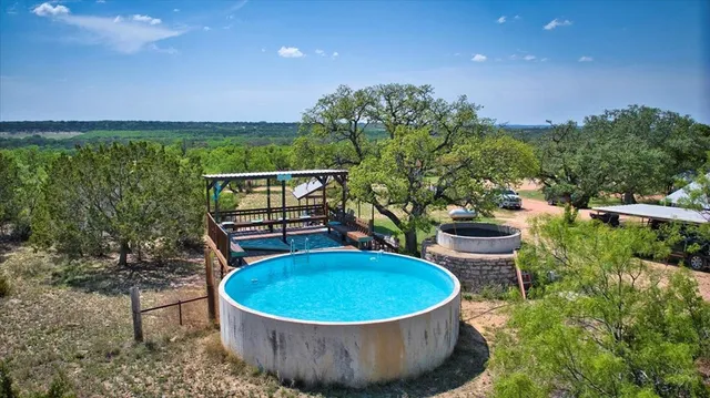 a living room with furniture a fireplace and wooden floor