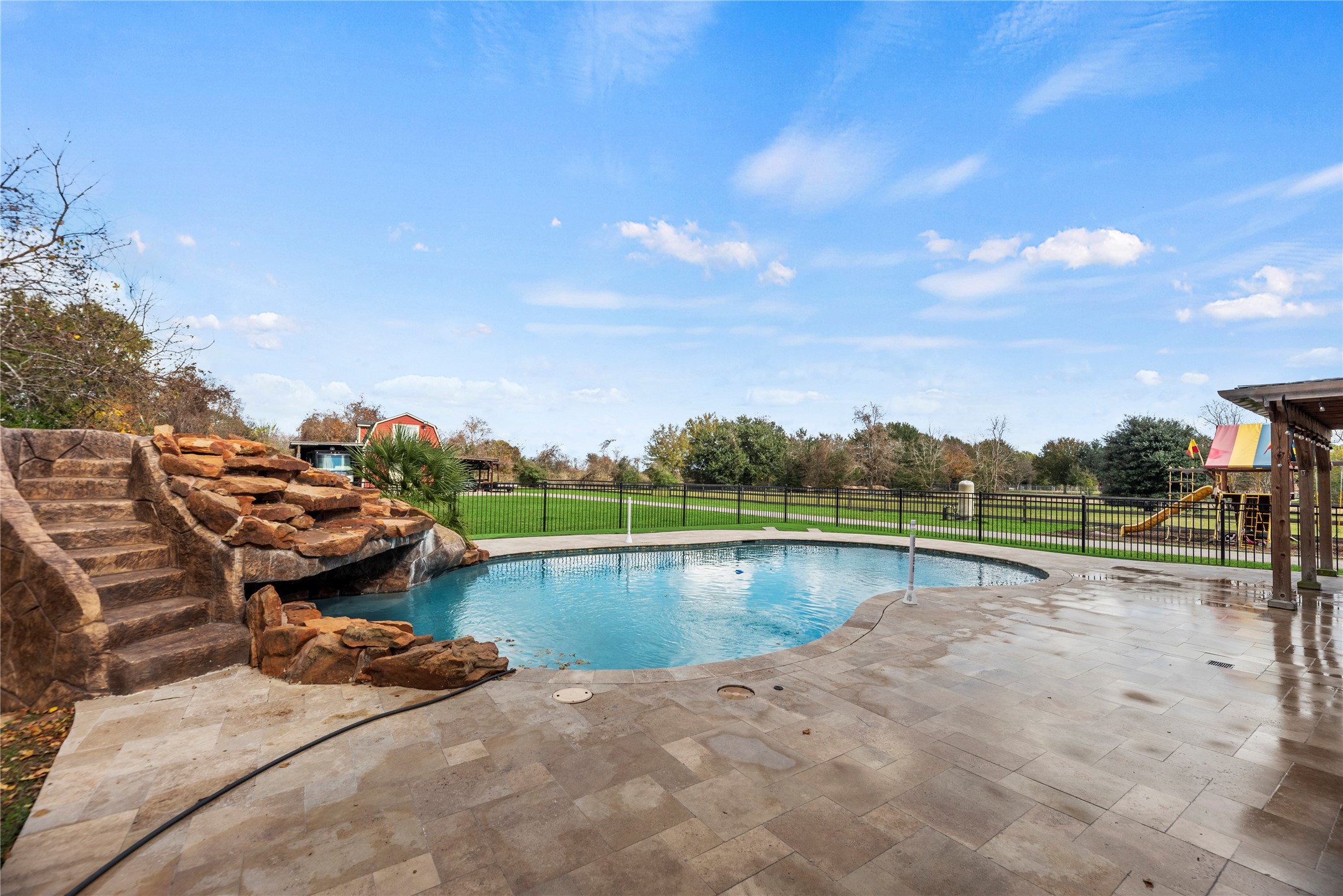 30914 Coco Street Cypress, TX 77433 - Photo 37 of 47 Sparkling pool with a grotto and slide.