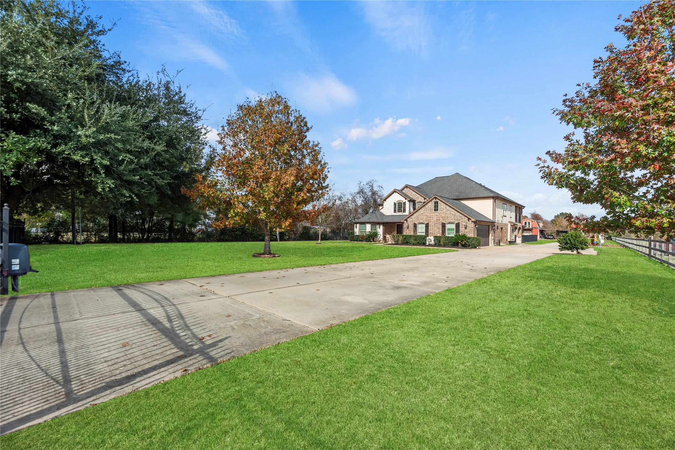 30914 Coco Street Cypress, TX 77433 - Photo 4 of 47 Long, double-wide driveway leads to the home and to the barn.