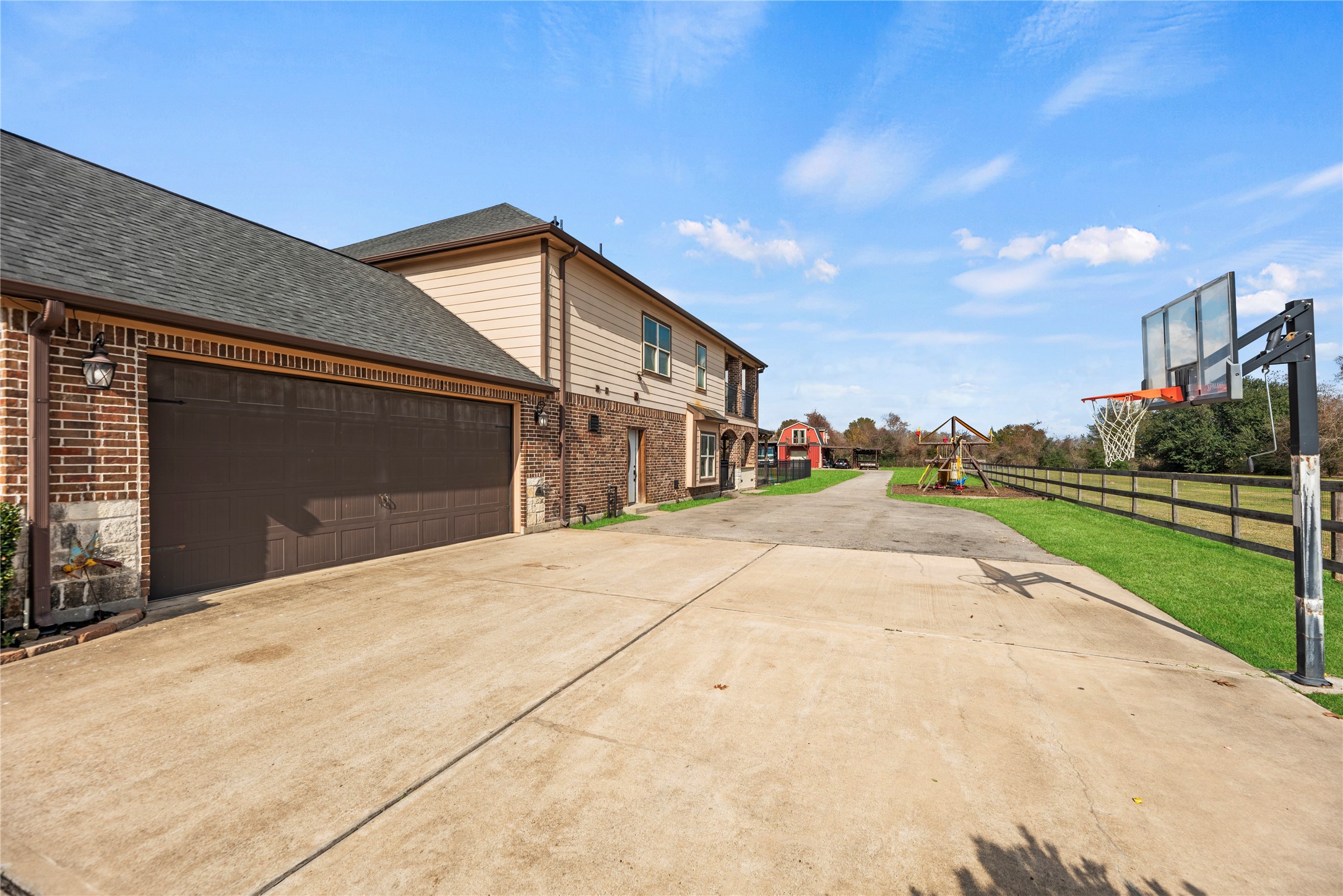 30914 Coco Street Cypress, TX 77433 - Photo 6 of 47 2-car attached garage and built-in basketball goal.