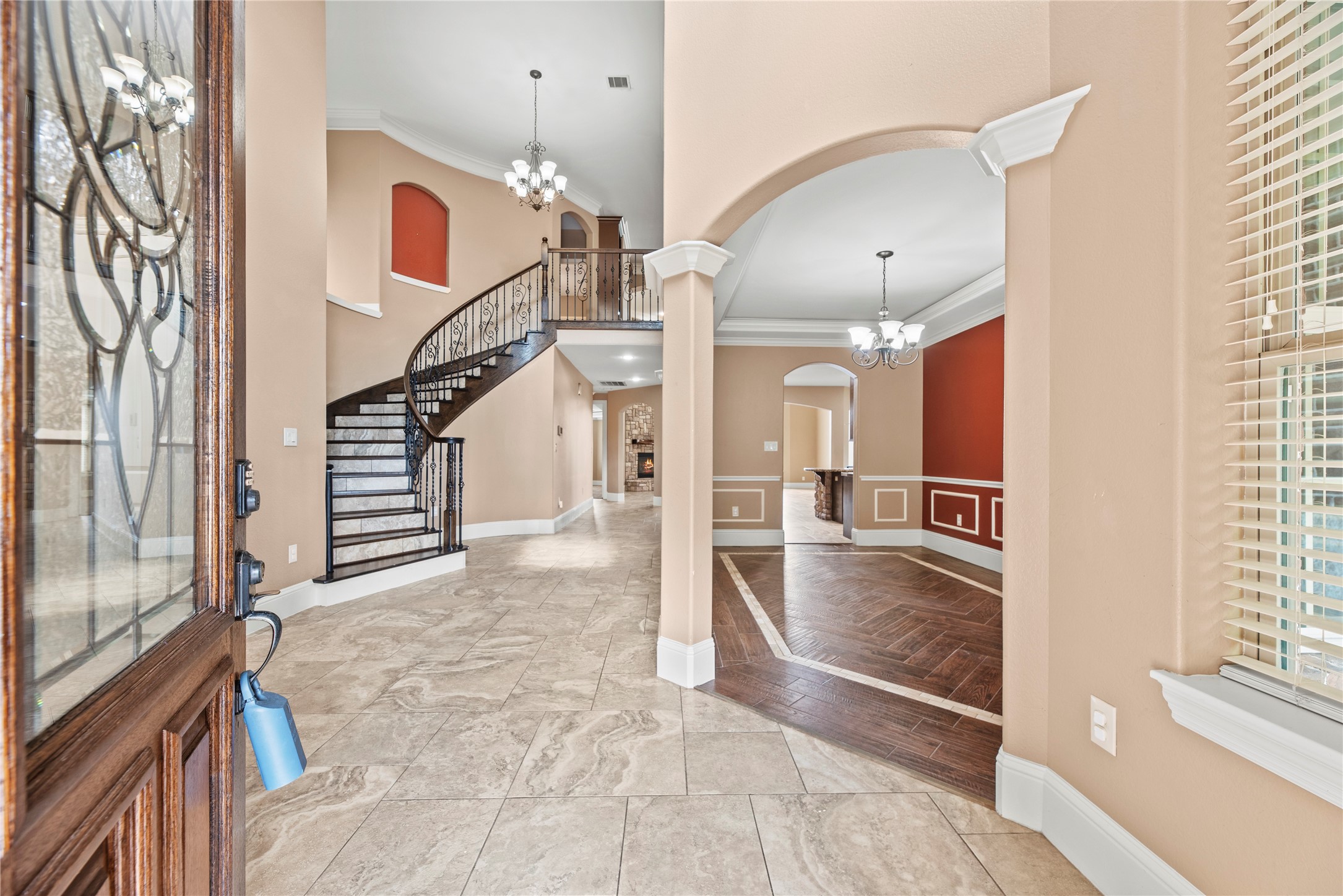 30914 Coco Street Cypress, TX 77433 - Photo 7 of 47 Stunning entry boasts a curved wrought iron staircase, high ceilings and crown molding.