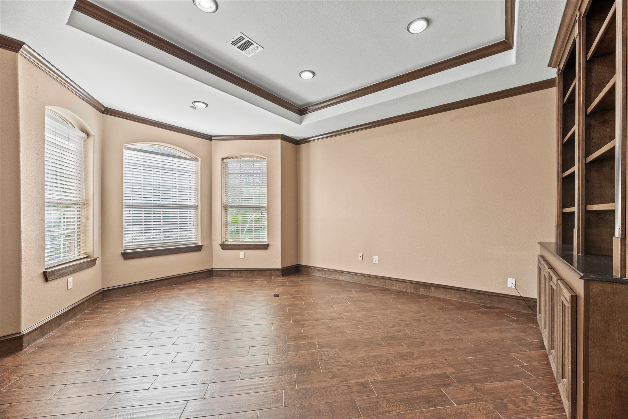 30914 Coco Street Cypress, TX 77433 - Photo 8 of 47 Home office features a handsome tray ceiling, crown molding, bay window and built-ins.