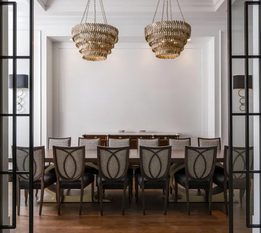 a view of a table and chairs in wooden floor