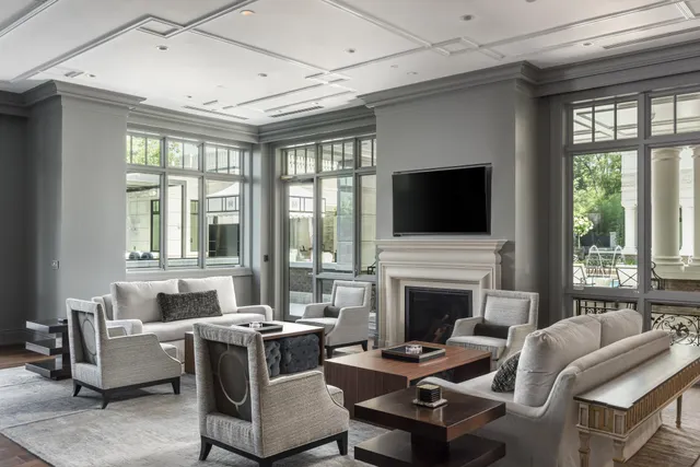 a living room with fireplace furniture and a flat screen tv