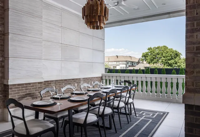 a view of a chairs and table in patio