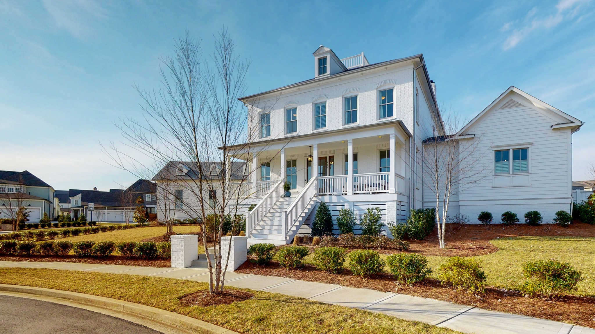a view of a street that has couple of cars parked on road