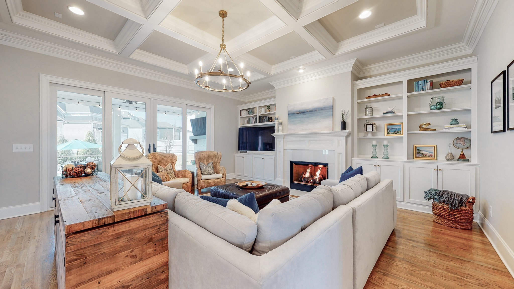601 Rieves Circle Franklin, TN 37064 - Photo 11 of 37 a living room with furniture a chandelier and a fireplace