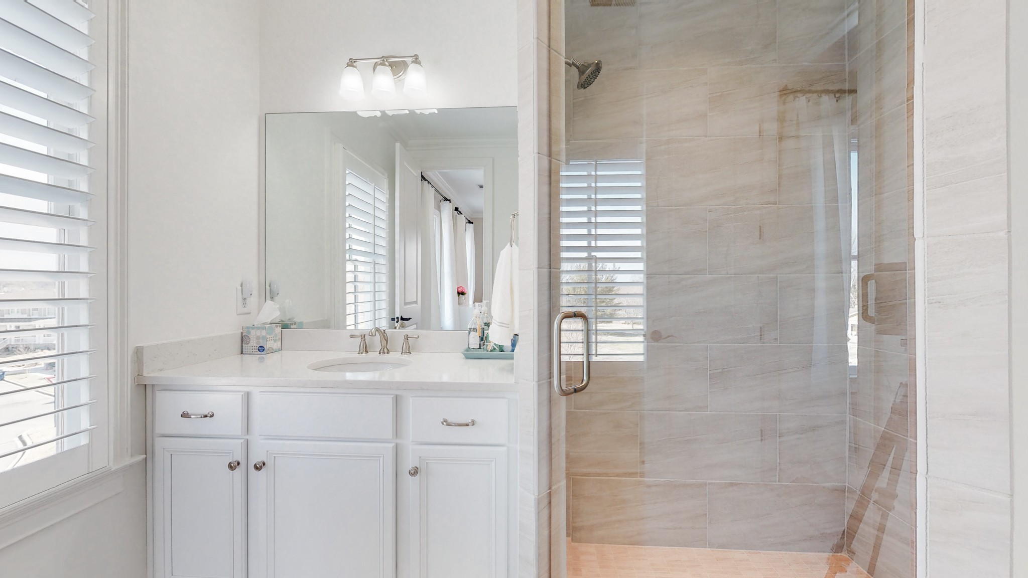 601 Rieves Circle Franklin, TN 37064 - Photo 33 of 37 a bathroom with a double vanity sink and a mirror