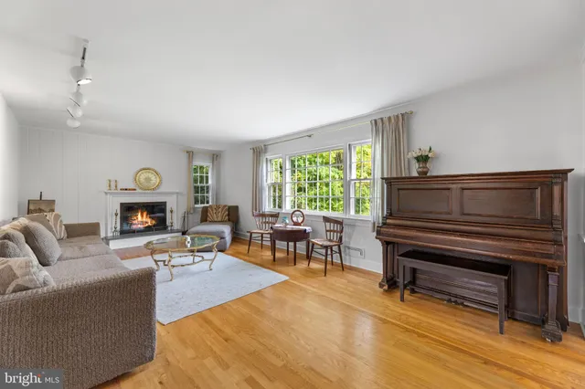 a view of a dining room with furniture and a window