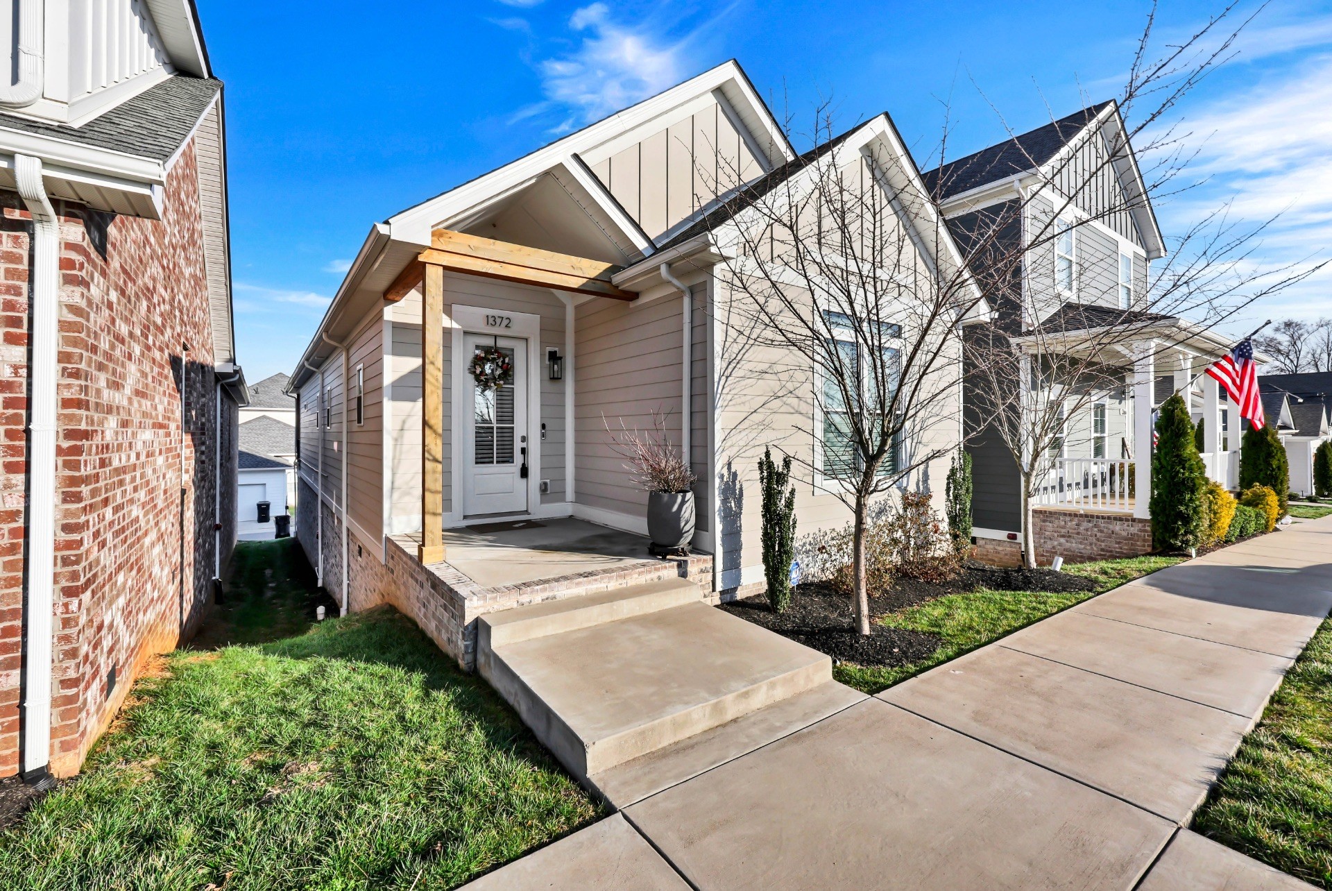 1372 Hicks Edgen Road Pleasant View, TN 37146 - Photo 2 of 37 a view of a brick house with many windows next to a road