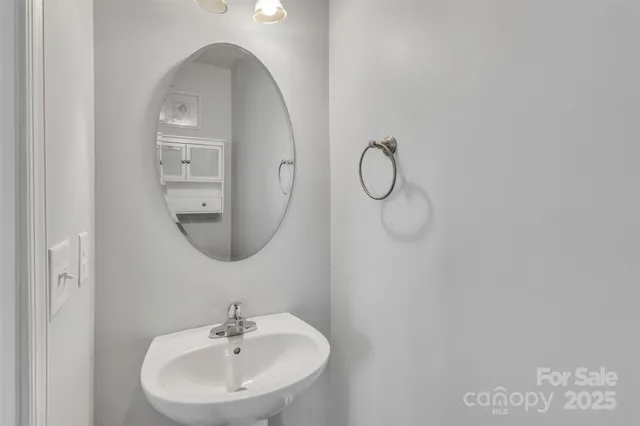 a bathroom with a sink and mirror
