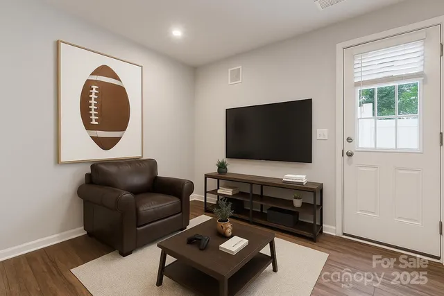 a living room with furniture and a flat screen tv