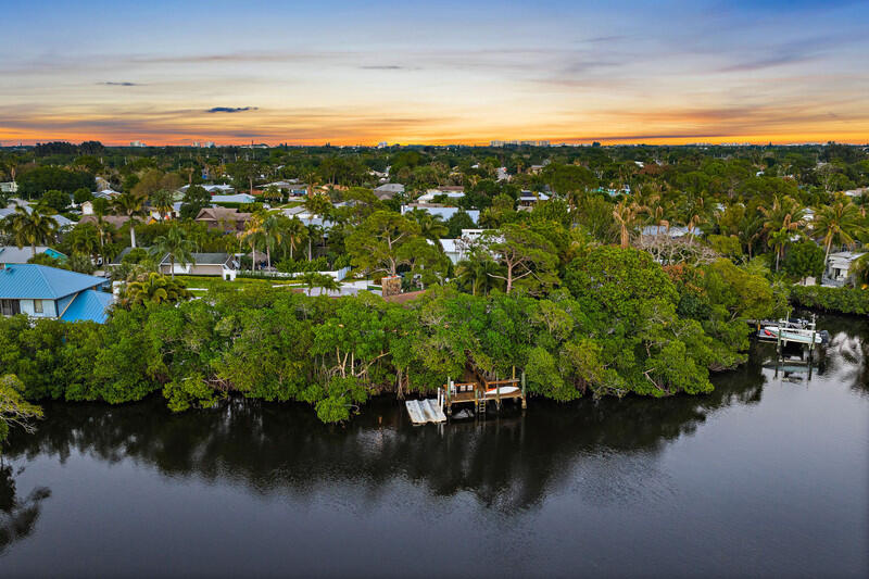 702 Warren Drive Jupiter, FL 33458 - Photo 69 of 76 a view of a lake with a city