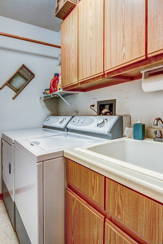 1437 Dresden Road Davis, IL 61019 - Photo 13 of 25 a utility room with stainless steel appliances white cabinets and a sink