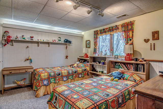 1437 Dresden Road Davis, IL 61019 - Photo 23 of 25 a bedroom with two beds and a chandelier