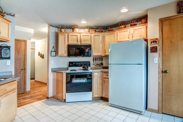 1437 Dresden Road Davis, IL 61019 - Photo 10 of 25 a kitchen with stainless steel appliances a refrigerator a stove a sink and a refrigerator