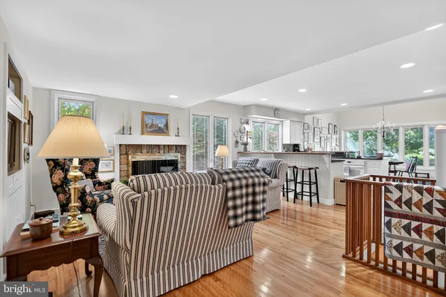 a living room with furniture fireplace and flat screen tv