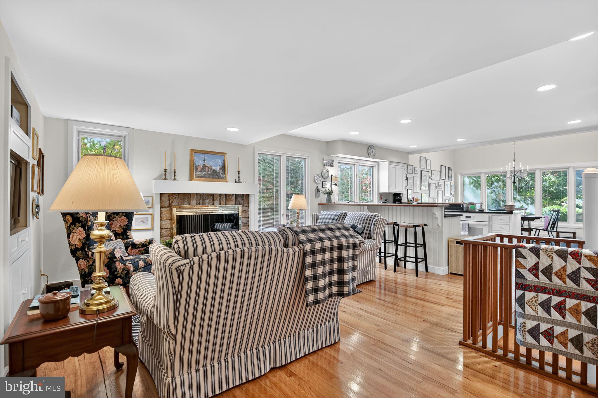 1 Fox Pond Place Spring House, PA 19477 - Photo 11 of 56 a living room with furniture a fireplace and a table