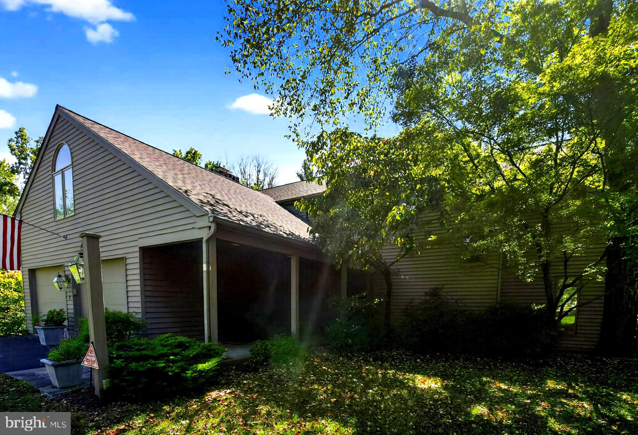 1 Fox Pond Place Spring House, PA 19477 - Photo 2 of 56 a front view of a house with a garden