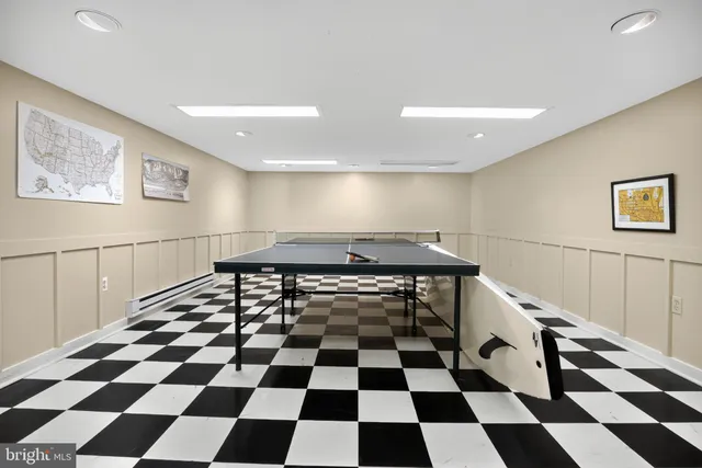 a view of a patio with table and chairs and potted plants