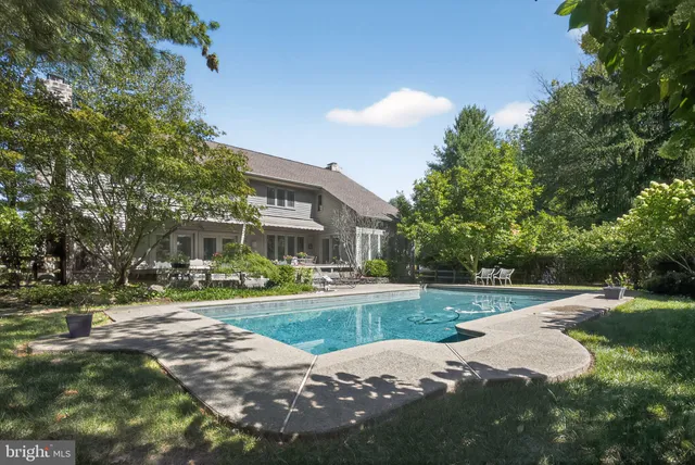 an aerial view of a house with yard and outdoor seating
