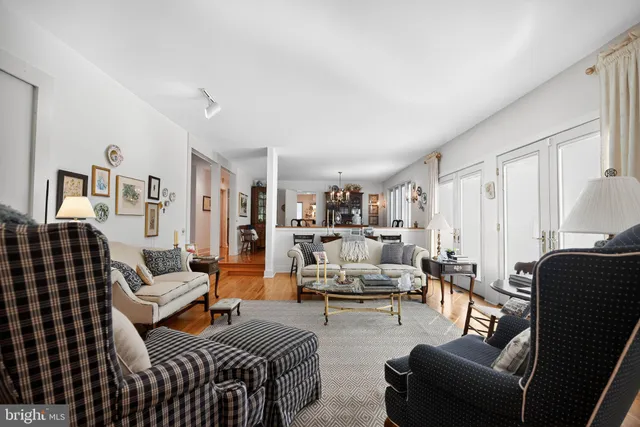 a living room with furniture or couch and a view of kitchen