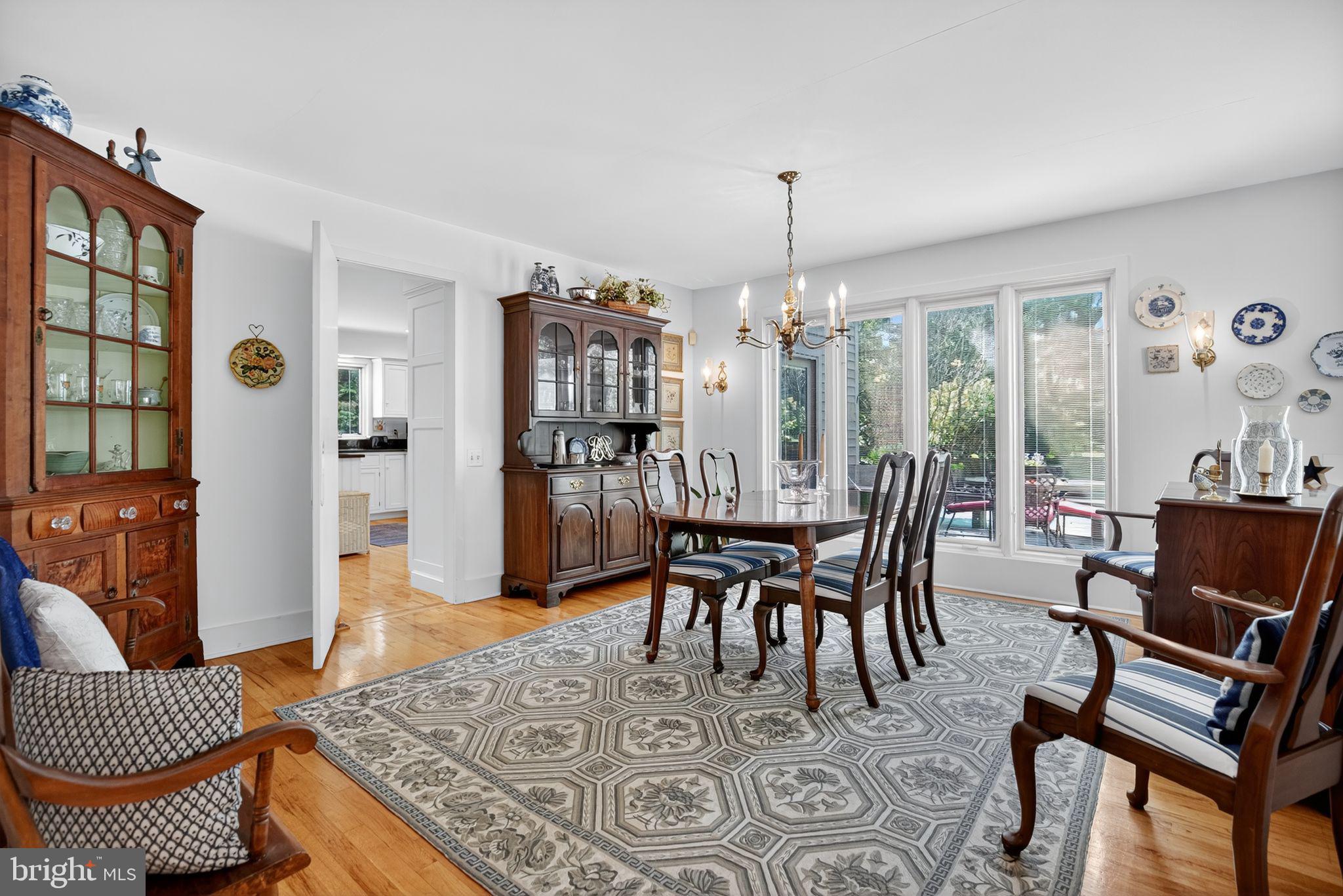 1 Fox Pond Place Spring House, PA 19477 - Photo 8 of 56 a dining room with furniture a rug and a chandelier
